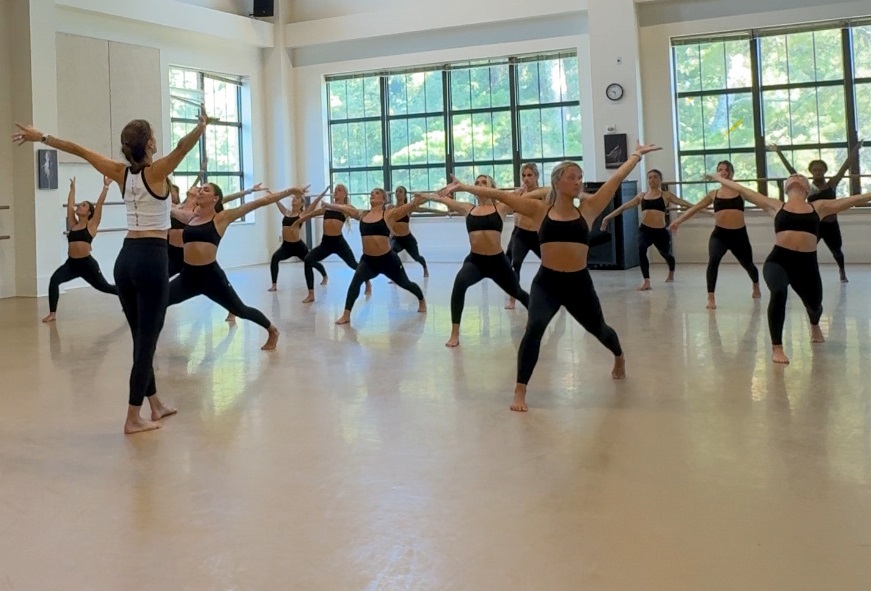 Sherri Meyers leads the LSU Golden Girls through a yoga flow during training camp 2025.