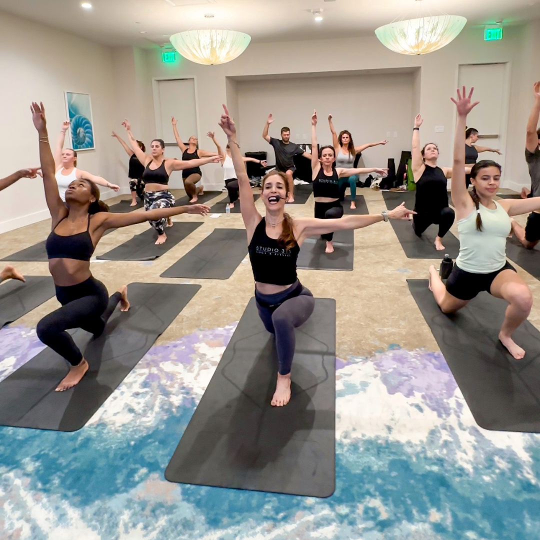 Sherri Meyers leads a full room of yogis through Inside Flow.